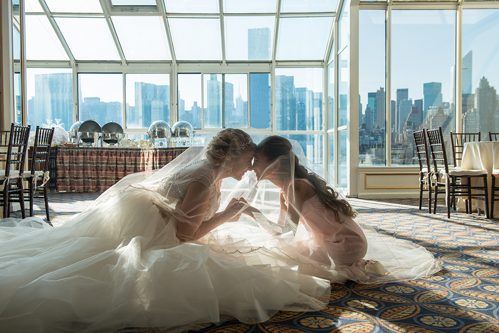 Romantic meaningful moment between a bride and a maid of honor.